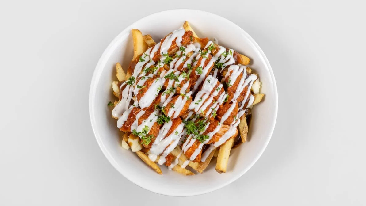 Buffalo chicken poutine with ranch drizzle at Calgary Pub & Restaurant in SE Calgary, AB