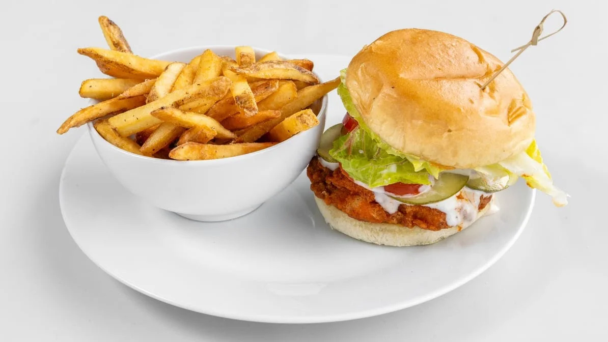 Crispy chicken burger with seasoned fries at Calgary Pub & Restaurant in SE Calgary, AB