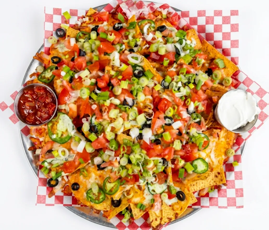 Loaded nachos with jalapeños and salsa at Calgary Pub & Restaurant, SE Calgary